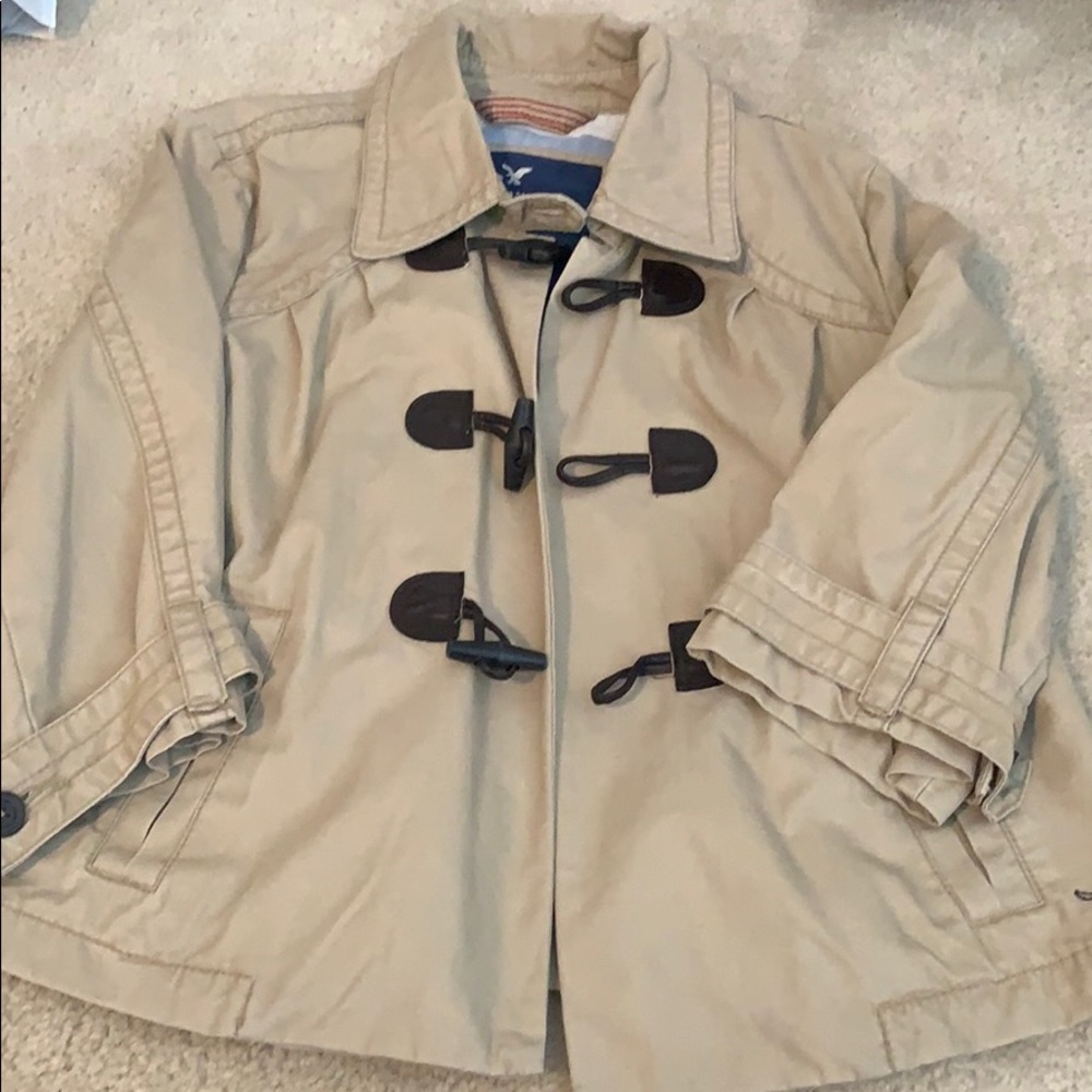 Adorable tan swing style trench.